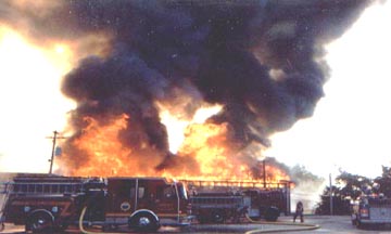 Fire consuming Levins Warehouse.  Engine 38 - 2 in the foreground.