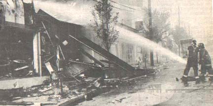 Mount Pleasant firemen hosing down the Hardware Store  that caught fire.