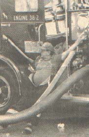 An unidentified M.P.V.F.D.  mans the controls of Engine 38 - 2.